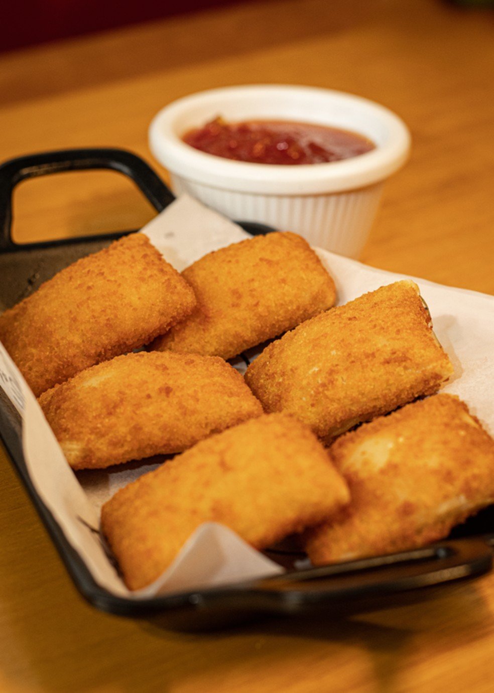 Almofadinha de queijo: item, que já integrava menu antigo, permanecerá na nova casa — Foto: Divulgação